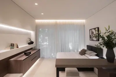 a bedroom with a bed and a large window at Kolonaki Luxury Studios in Athens