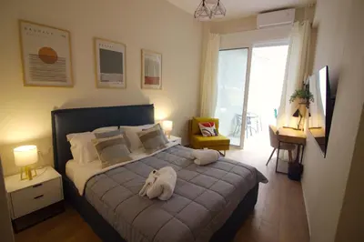 a bedroom with a bed with a stuffed animal on it at Secret Garden by Acropolis - Athens Central Gem in Athens