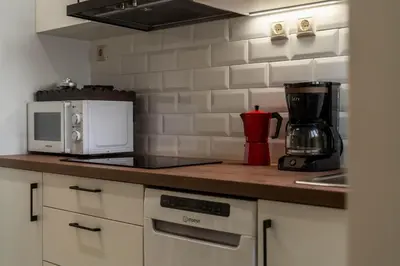 a kitchen counter with a microwave and a coffee maker at Relax & Comfy 2BR Apt Close To Athens Center in Athens