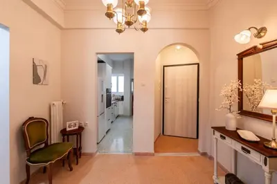 a room with a hallway with a mirror and a chair at Relax & Comfy 2BR Apt Close To Athens Center in Athens