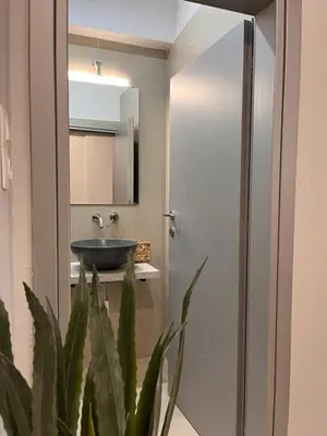 a bathroom with a sink and a mirror at Athens Urban Retreat Apartment - City Center - Fiber Wi-Fi in Athens