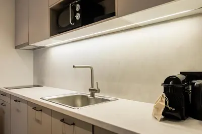 a kitchen with a sink and a counter top at KLEO by Zoia Living in Athens