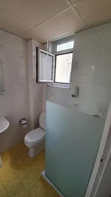 a bathroom with a toilet and a glass shower at Athens Lydia Hotel in Athens
