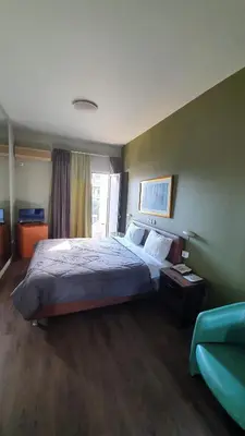 a bedroom with a bed in a room at Athens Lydia Hotel in Athens