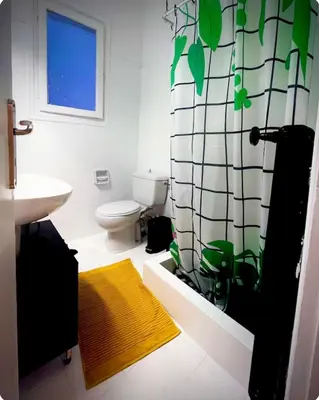 a bathroom with a sink and a toilet and a window at Apartment in the center of Athens! in Athens