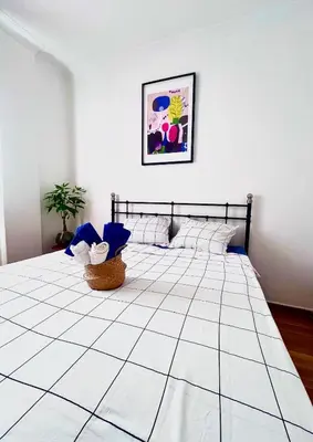 a bedroom with a large bed in a room at Apartment in the center of Athens! in Athens