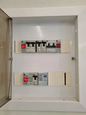 a white wall with shelves with machines on it at Pavlina Artistic Βeauty 33sqm metro 7' in Athens