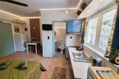a kitchen with a sink and a counter top at Pavlina Artistic Βeauty 33sqm metro 7' in Athens