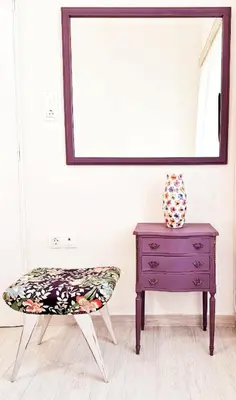 a table and a chair next to a mirror at 26 HoMe in Athens