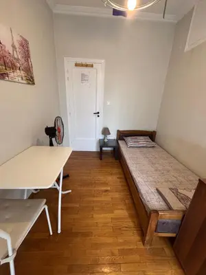 a bedroom with a bed in the corner of a room at Onix 2 in Athens