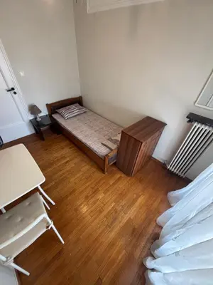a small room with a bed and a desk at Onix 2 in Athens