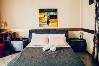 a bedroom with a bed with two towels on it at Filio House-Feels Like Home in Athens