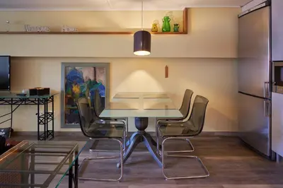 a dining room with a table and chairs at Cool ambiance, 2Brs , Private Garden & Parking in Athens