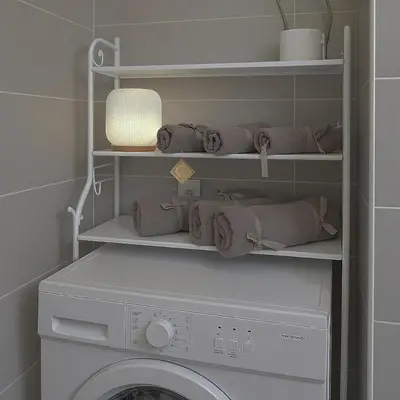 a laundry room with a washing machine and towels at ZEUS - Zen Exarchia Urban Studio in Athens