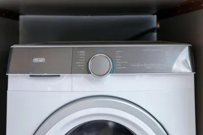 a washing machine with its door open in a car at Jocasta - Cocoon Apartment Near Metro Station in Athens