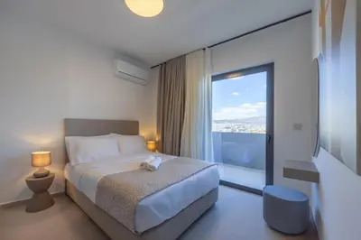 a hotel room with a bed and a large window at Sokio Attiki Hotel, BW Premier Collection in Athens