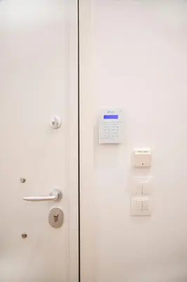 a white door with a clock on it at The New Flat 183 - Ground floor, fully renovated in Athens