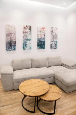a living room with a couch and two tables at The New Flat 183 - Ground floor, fully renovated in Athens