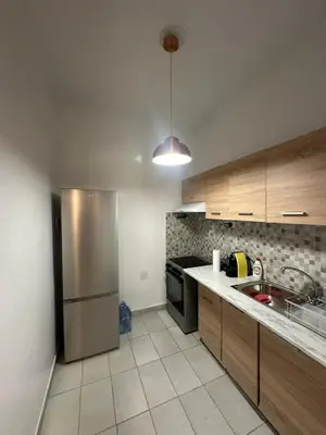 a kitchen with a stainless steel refrigerator and a sink at Central Modern Stay Apartment-5min walk from metro in Athens