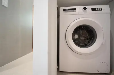 a white washer and dryer in a room at RoomsByRamez -Chill Bright Stay- -Central Athens- in Athens