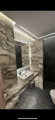 a bathroom with a sink and a mirror at Lush Studio Apartment in Athens