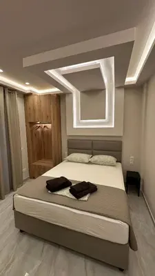 a bedroom with a large bed in a room at Lush Studio Apartment in Athens