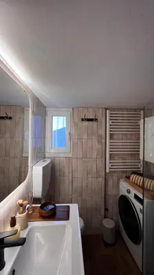 a bathroom with a sink and a washing machine at Acropolis Sunset Paradise in Athens