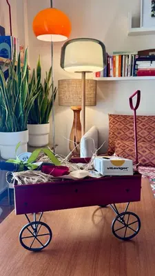 a coffee table in a living room with plants at Acropolis Sunset Paradise in Athens