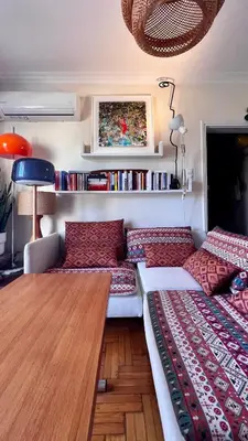 a living room with a couch and a table at Acropolis Sunset Paradise in Athens