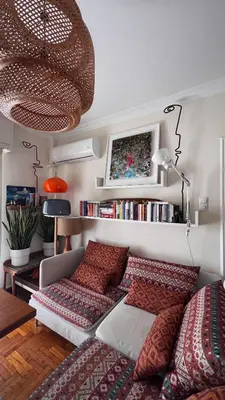 a bedroom with a bed and a shelf with books at Acropolis Sunset Paradise in Athens
