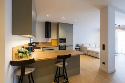 a kitchen with a counter and two stools at Rooms151 Premium Suite in the Heart of Athens 4th floor-9 in Athens