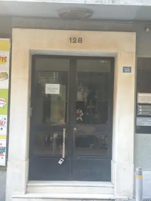 a front door of a building with a sign on it at Solonos Amber Muse in Athens