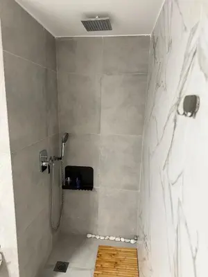 a shower stall in a bathroom with a shower at The Athenian Chic in Athens