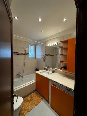 a bathroom with a tub and a sink and a toilet at Central Athens Unique Apartment in Athens