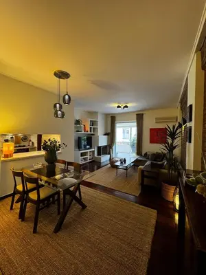 a living room with a table and a couch at Central Athens Unique Apartment in Athens