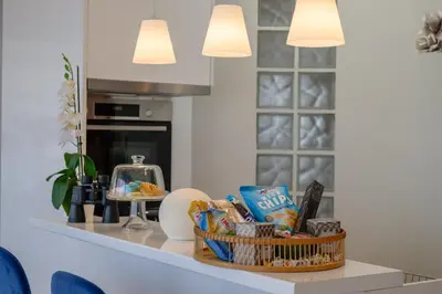 a kitchen counter with a basket of food on it at Sky Suite with View & Jacuzzi in Athens