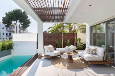 a living room with white furniture and a swimming pool at 3BD 2 Floor Maisonette with Pool in Athens