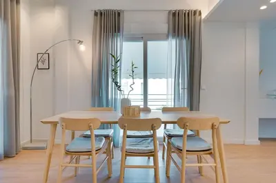 a dining room with a table and four chairs at Kerameikos Acropolis view in Athens