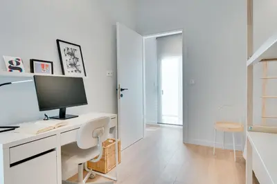 a white office with a desk with a computer on it at Kerameikos Acropolis view in Athens