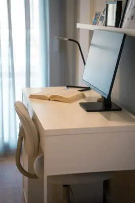 a desk with a computer and a lamp on it at Kerameikos Acropolis view in Athens