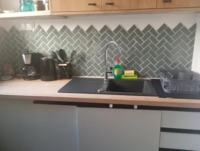 a kitchen counter with a sink in a kitchen at Down town in Athens