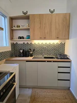 a kitchen with a sink and a counter top at Down town in Athens