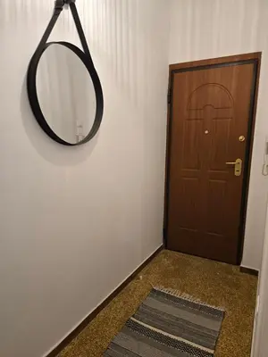 a mirror hanging on a wall next to a door at Down town in Athens