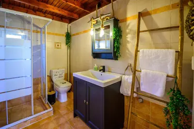 a bathroom with a sink and a shower and a toilet at NoamansHouse SeaView near Airport in Artemida