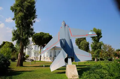 a statue of a plane sitting on top of a field at City Center 2-Bedroom Sun home in Athens