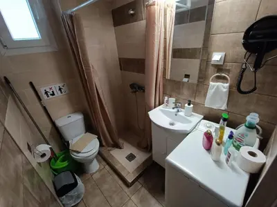 a small bathroom with a sink and a toilet at Knezevic Resort 12 in Athens