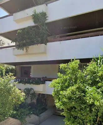 a building with plants on the side of it at Marnik House in Athens