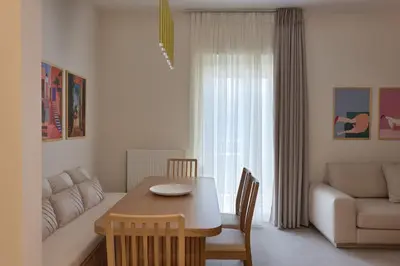 a living room with a table and a couch at Prestige Lifestyle 3bd Apt in Kolonaki in Athens