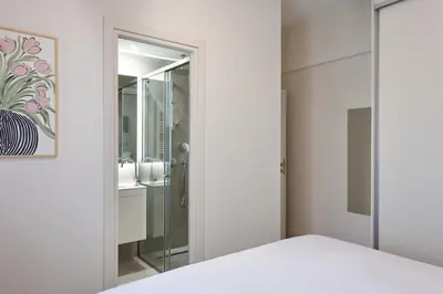 a bedroom with a glass door leading to a shower at Prestige Lifestyle 3bd Apt in Kolonaki in Athens
