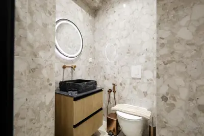 a bathroom with a sink and a toilet at O Suite - 105 in Athens